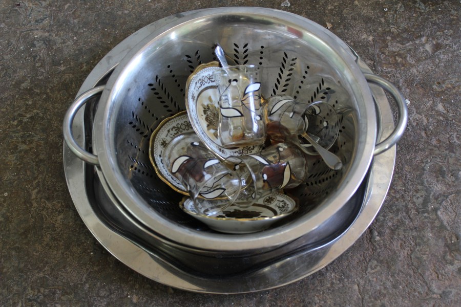 Cha (tea) clean-up. You put all the tea supplies in the bowl: tea glasses, saucers, and teaspoons. Then you pour boiling water over it all and you're done. 