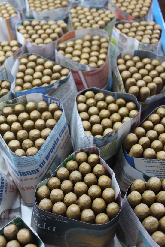 Finished cigars, wrapped in newspaper and awaiting boxing.